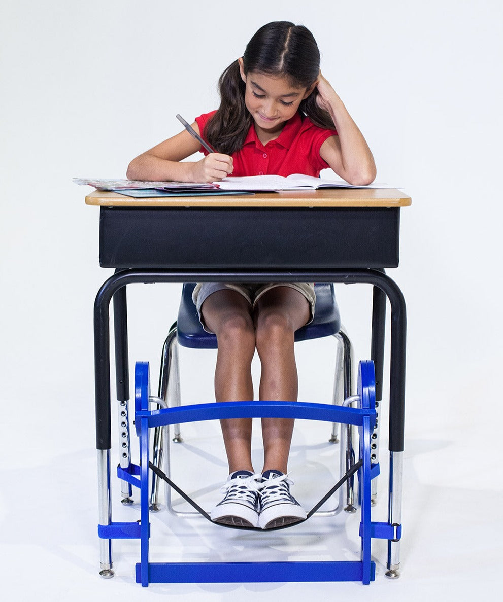 Child sitting at desk using Kinnebar 100